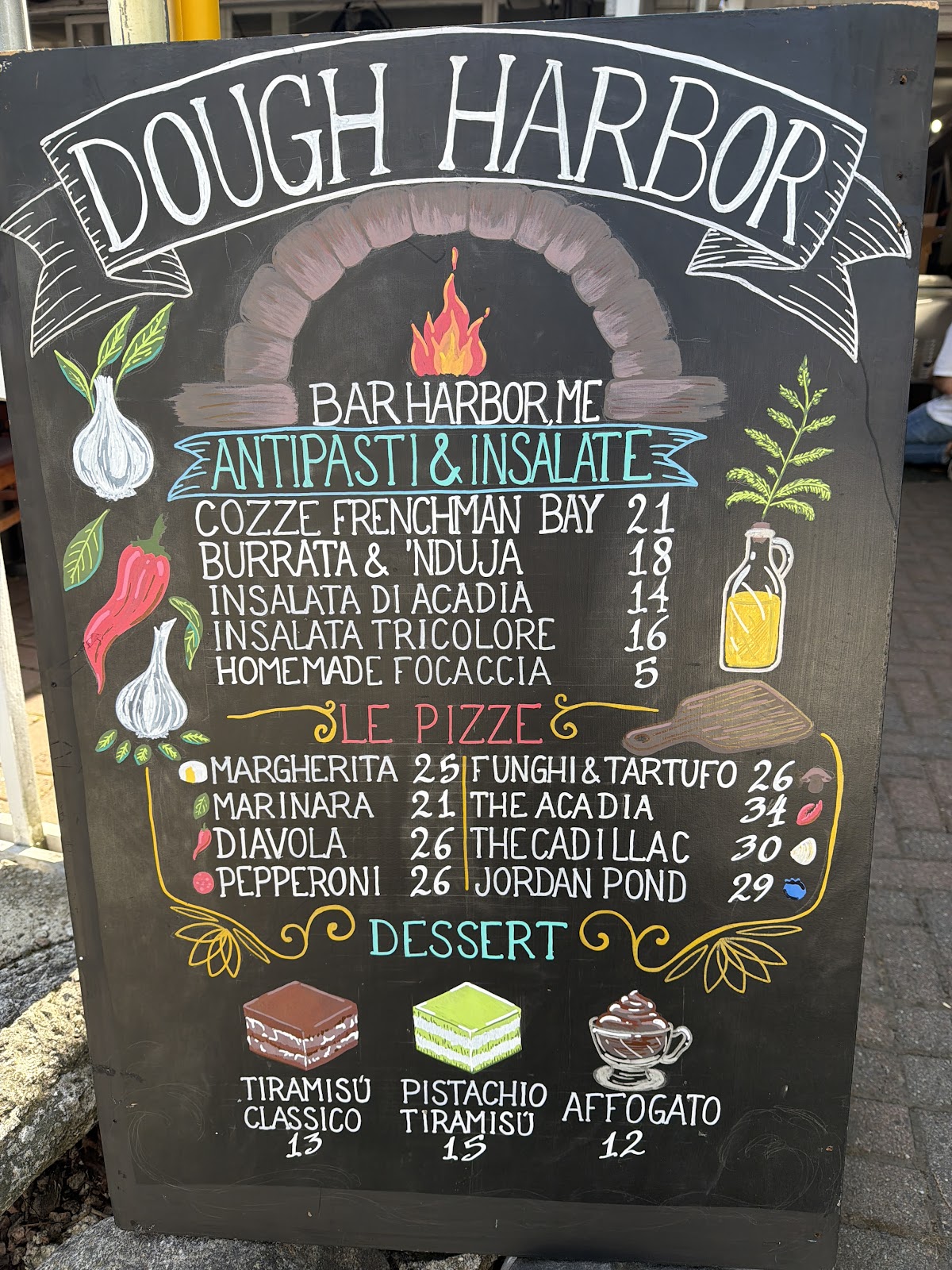 A photographed Dough Harbor chalkboard sign