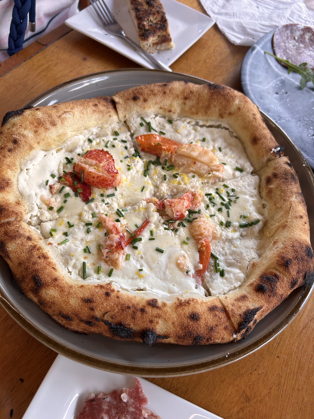 A round baked dish photographed on a table at Dough Harbor